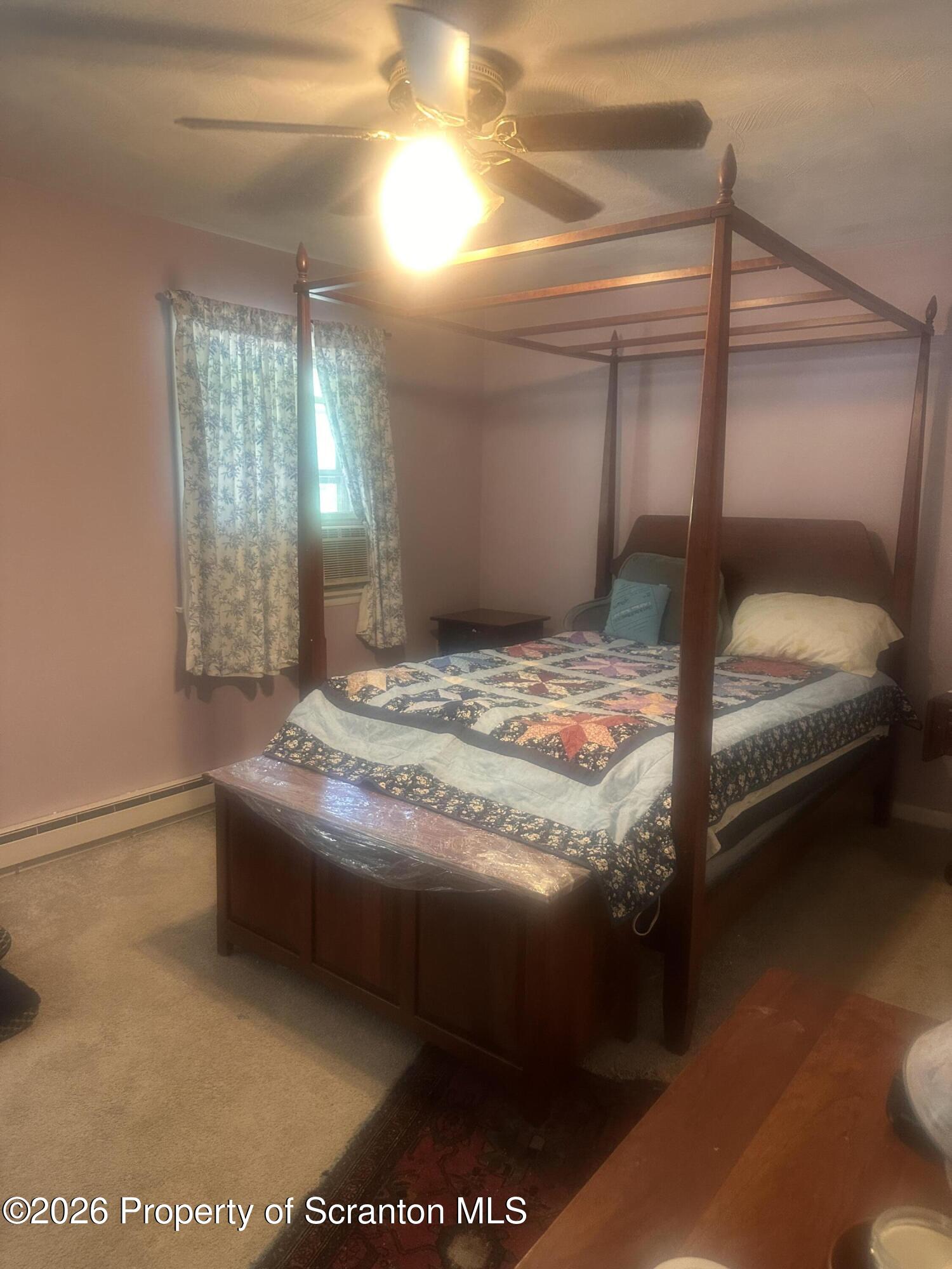107 Keystone Hls Road, Unit 405 Factoryville, PA 18419 - Photo 22 of 27 a bedroom with a bed and window