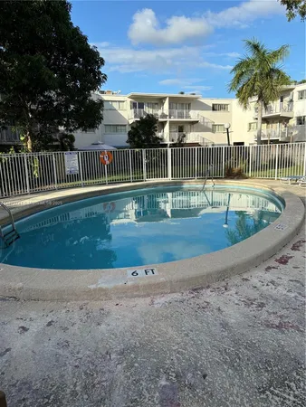 a view of swimming pool with a yard
