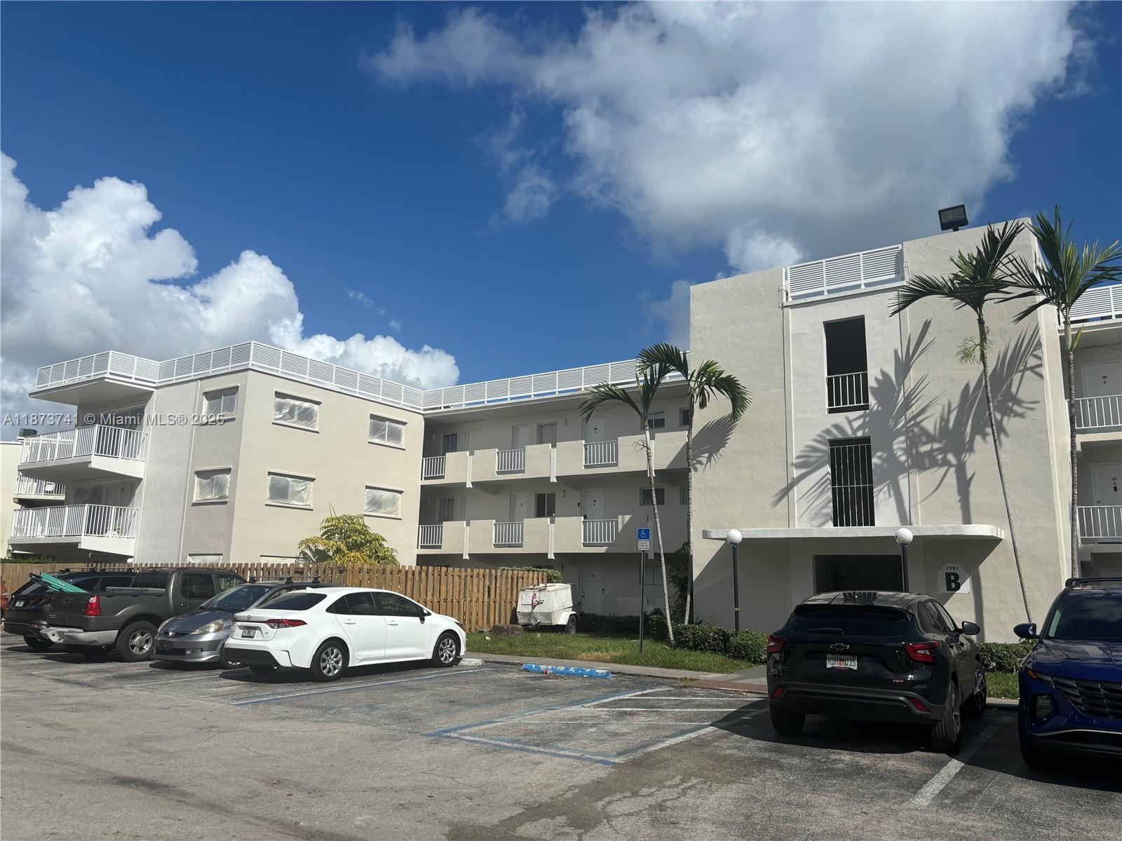 7701 Southwest 88th Street, Unit B224 Miami, FL 33156 - Photo 2 of 14 a view of parking