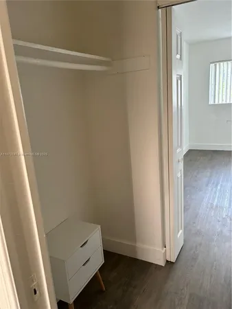 a room with a hardwood and a sink