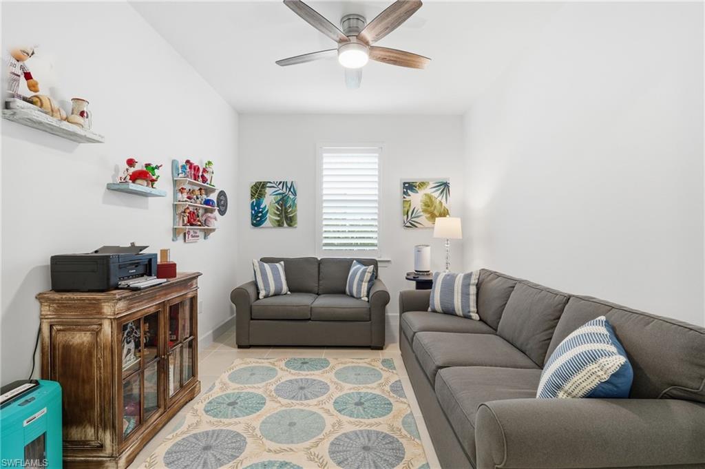 18364 Ridgeline Drive Estero, FL 33928 - Photo 19 of 50 a living room with furniture and a window