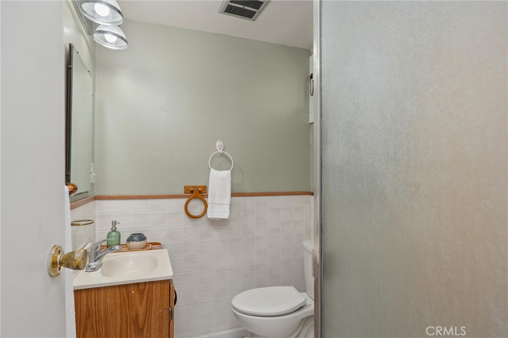 1805 Hemlock Street Chico, CA 95928 - Photo 33 of 62 a bathroom with a sink a toilet and a mirror