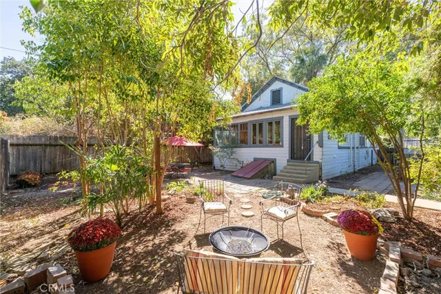 a living room with furniture and a book shelf