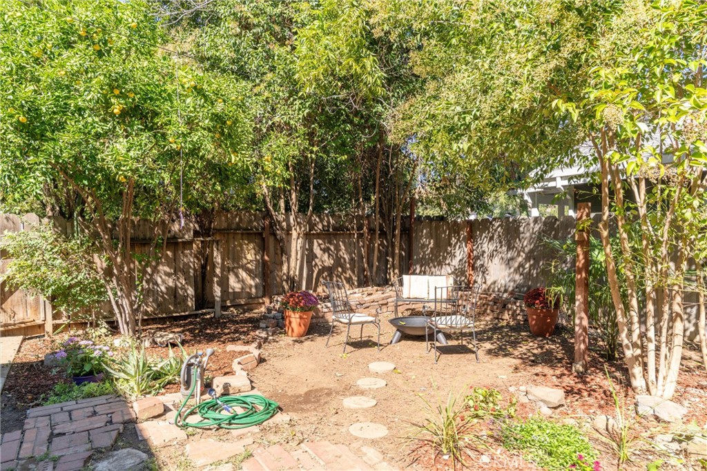 1805 Hemlock Street Chico, CA 95928 - Photo 41 of 62 a view of a fire pit with large trees