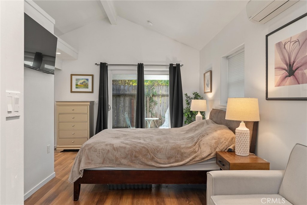 1805 Hemlock Street Chico, CA 95928 - Photo 50 of 62 a bedroom with a bed and wooden floor