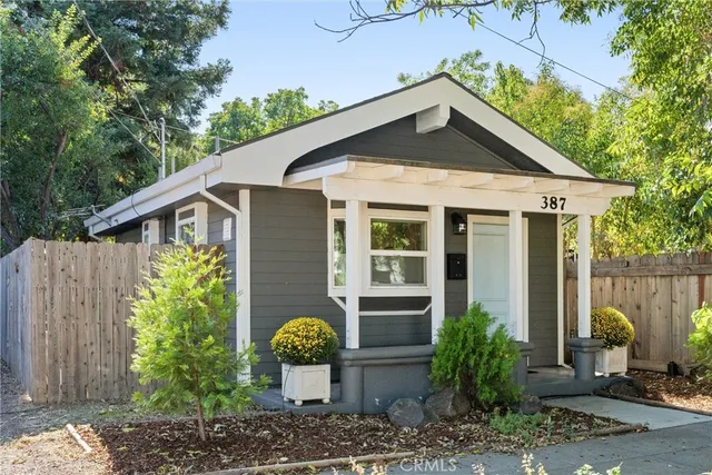 a kitchen with refrigerator and window