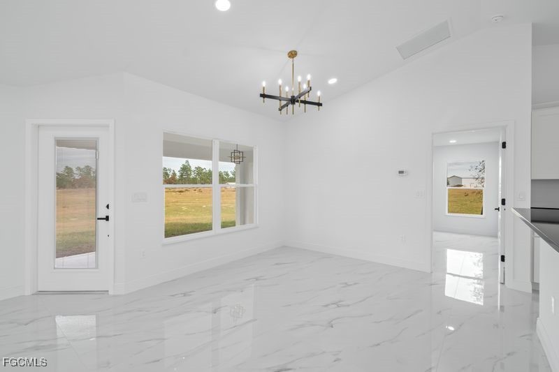 14461 Southeast 80th Street Morriston, FL 32668 - Photo 17 of 37 wooden floor in an empty room with a window