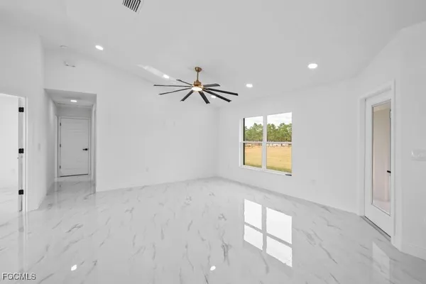 a view of an empty room with a window