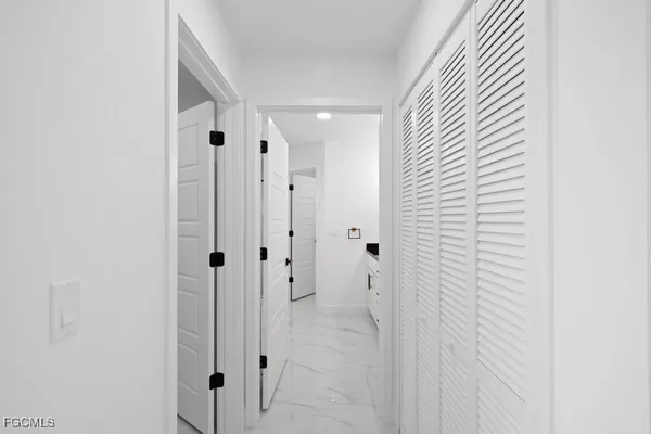 a bathroom with a shower and a sink