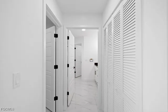 a bathroom with a shower and a sink