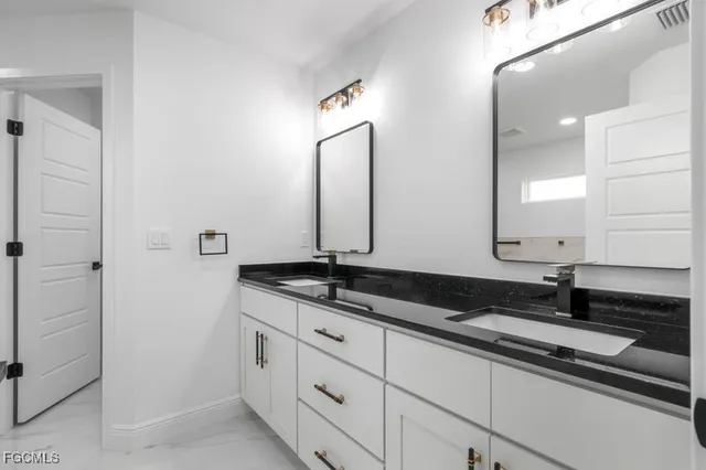 a bathroom with a sink and shower