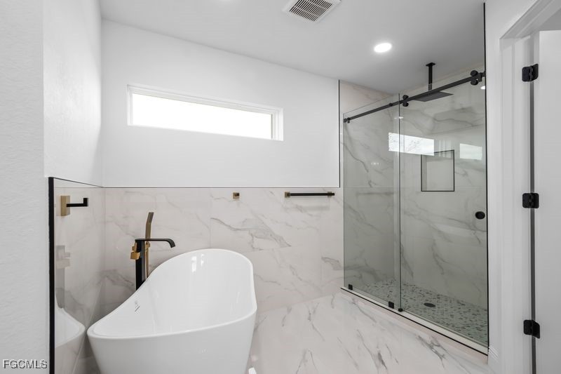 14461 Southeast 80th Street Morriston, FL 32668 - Photo 30 of 37 a bathroom with a sink and shower