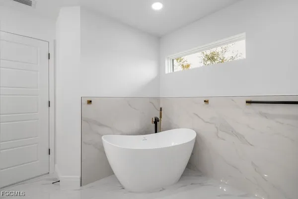 a close up of a utility room with washer and dryer