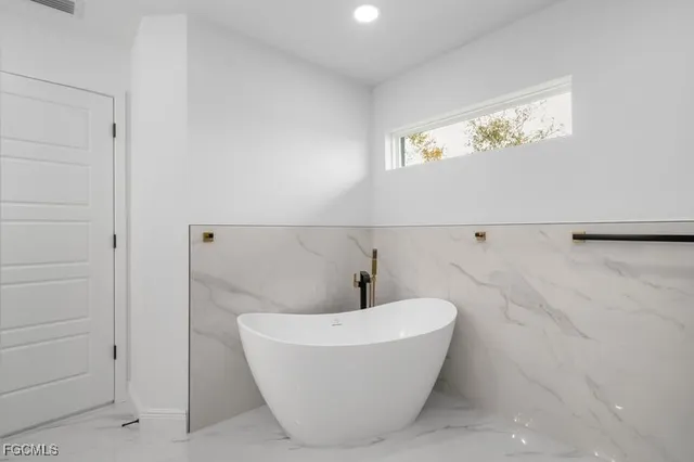 a close up of a utility room with washer and dryer