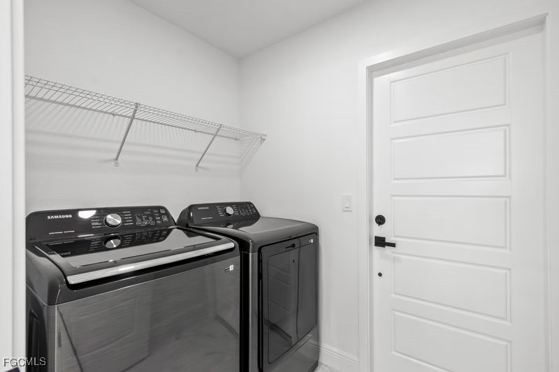 14461 Southeast 80th Street Morriston, FL 32668 - Photo 32 of 37 a close up of a utility room with washer and dryer