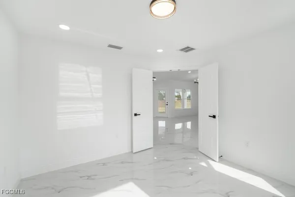 a view of a hallway with wooden shelves