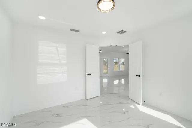 a view of a hallway with wooden shelves