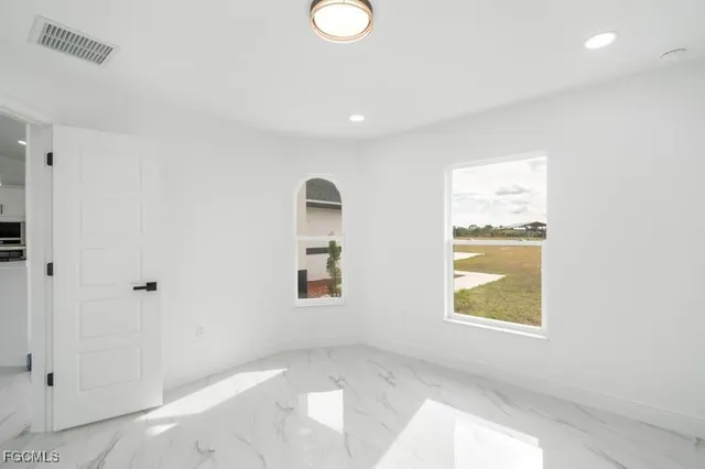 an empty room with windows