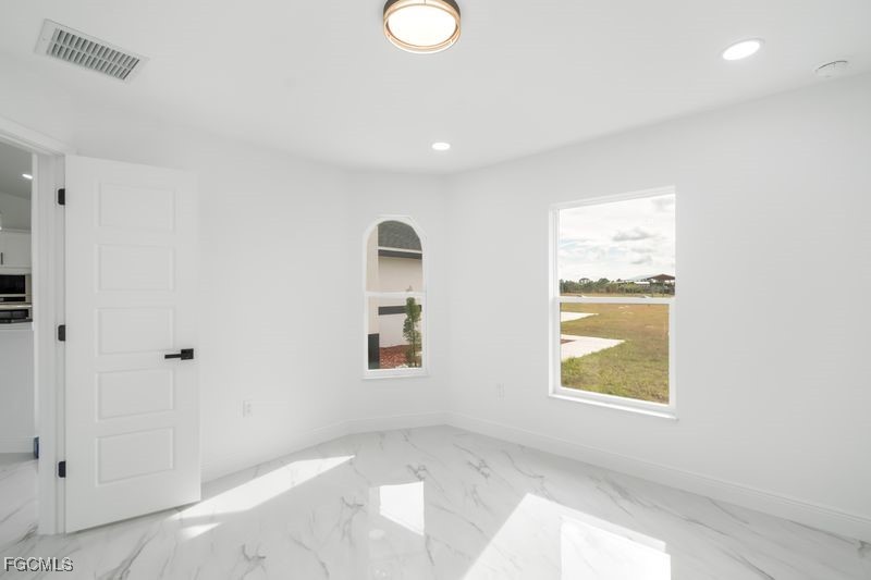 14461 Southeast 80th Street Morriston, FL 32668 - Photo 8 of 37 an empty room with windows