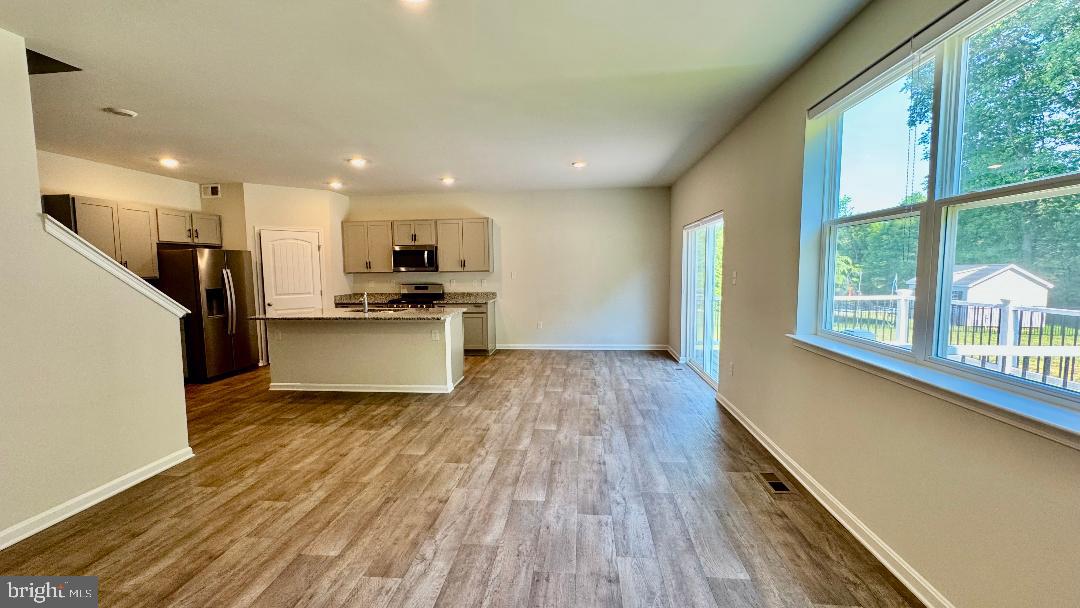 1236 Pimpernell Path Middletown, DE 19709 - Photo 4 of 37 a view of a kitchen with wooden floor and electronic appliances
