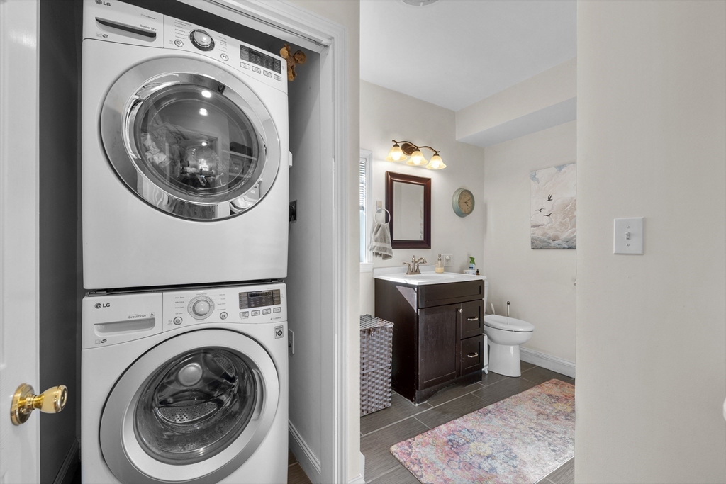 38 Brook Street Georgetown, MA 01833 - Photo 13 of 42 a view of a hallway with washer and dryer