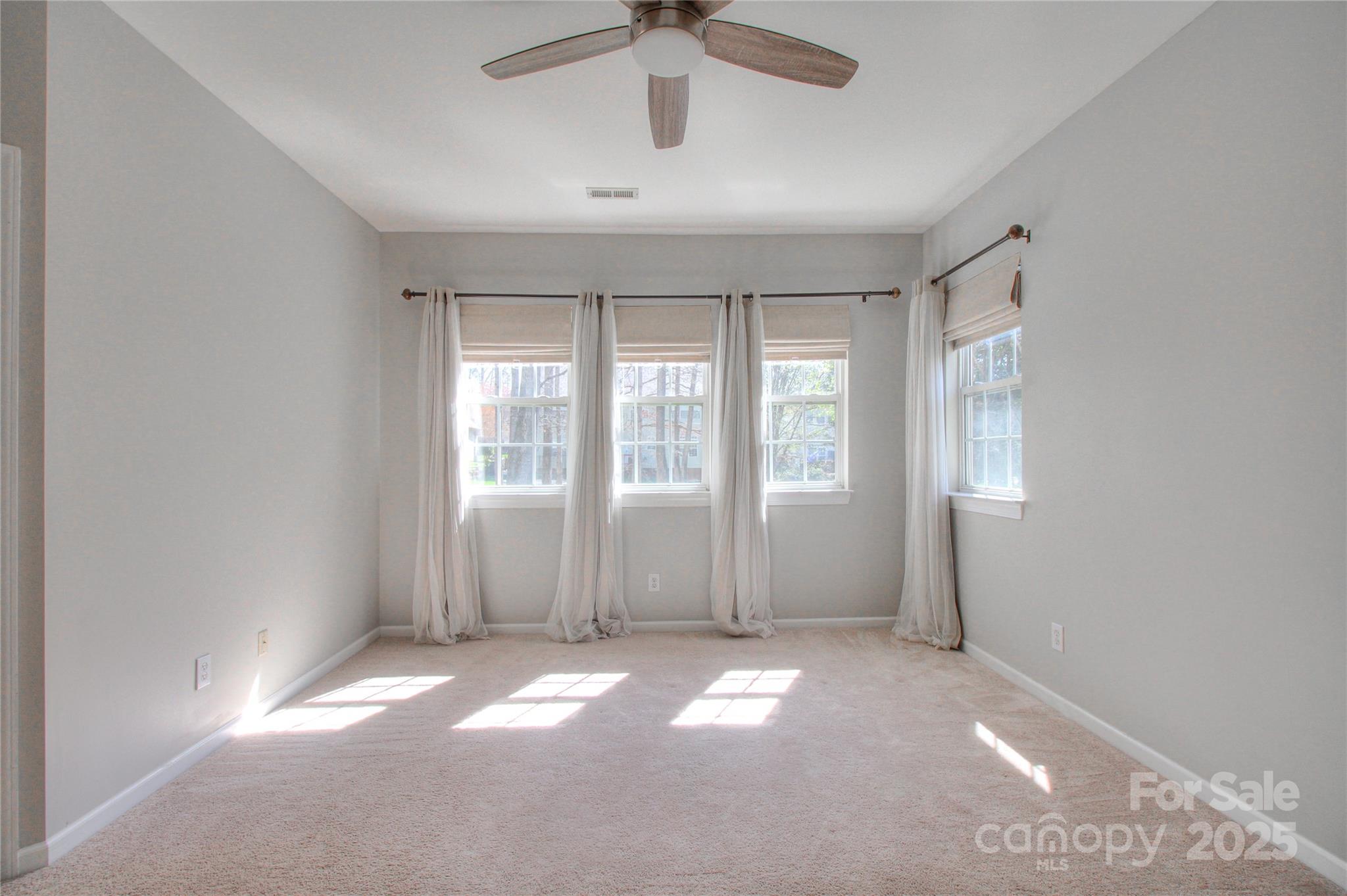 8414 Bampton Drive Concord, NC 28027 - Photo 17 of 32 a view of an empty room with a window