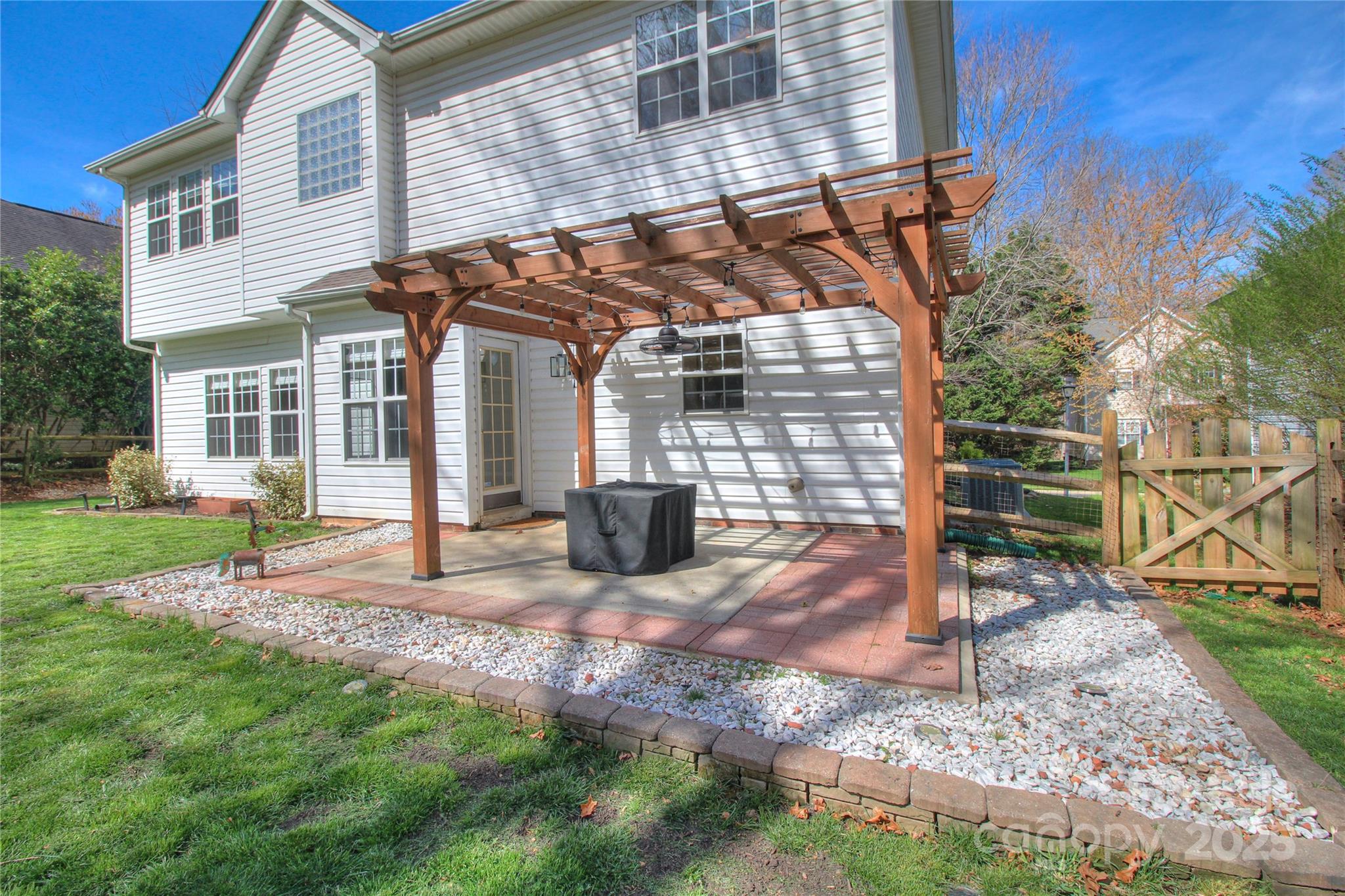 8414 Bampton Drive Concord, NC 28027 - Photo 26 of 32 a view of a house with backyard of the house