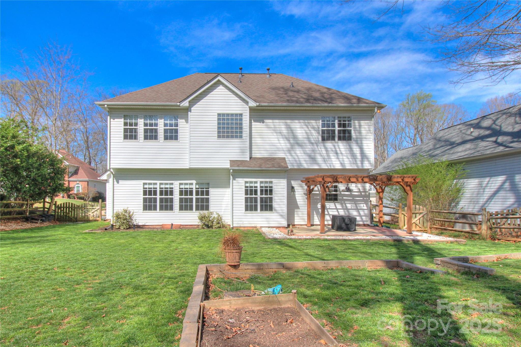 8414 Bampton Drive Concord, NC 28027 - Photo 32 of 32 a front view of a house with garden