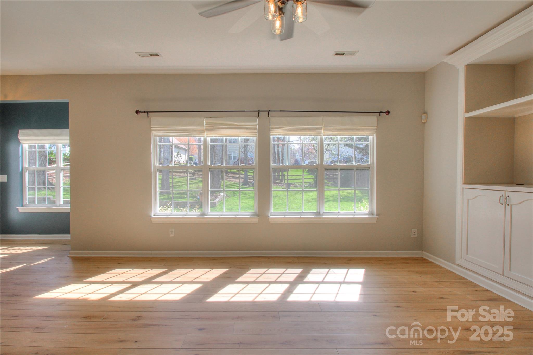 8414 Bampton Drive Concord, NC 28027 - Photo 7 of 32 a view of an empty room and window