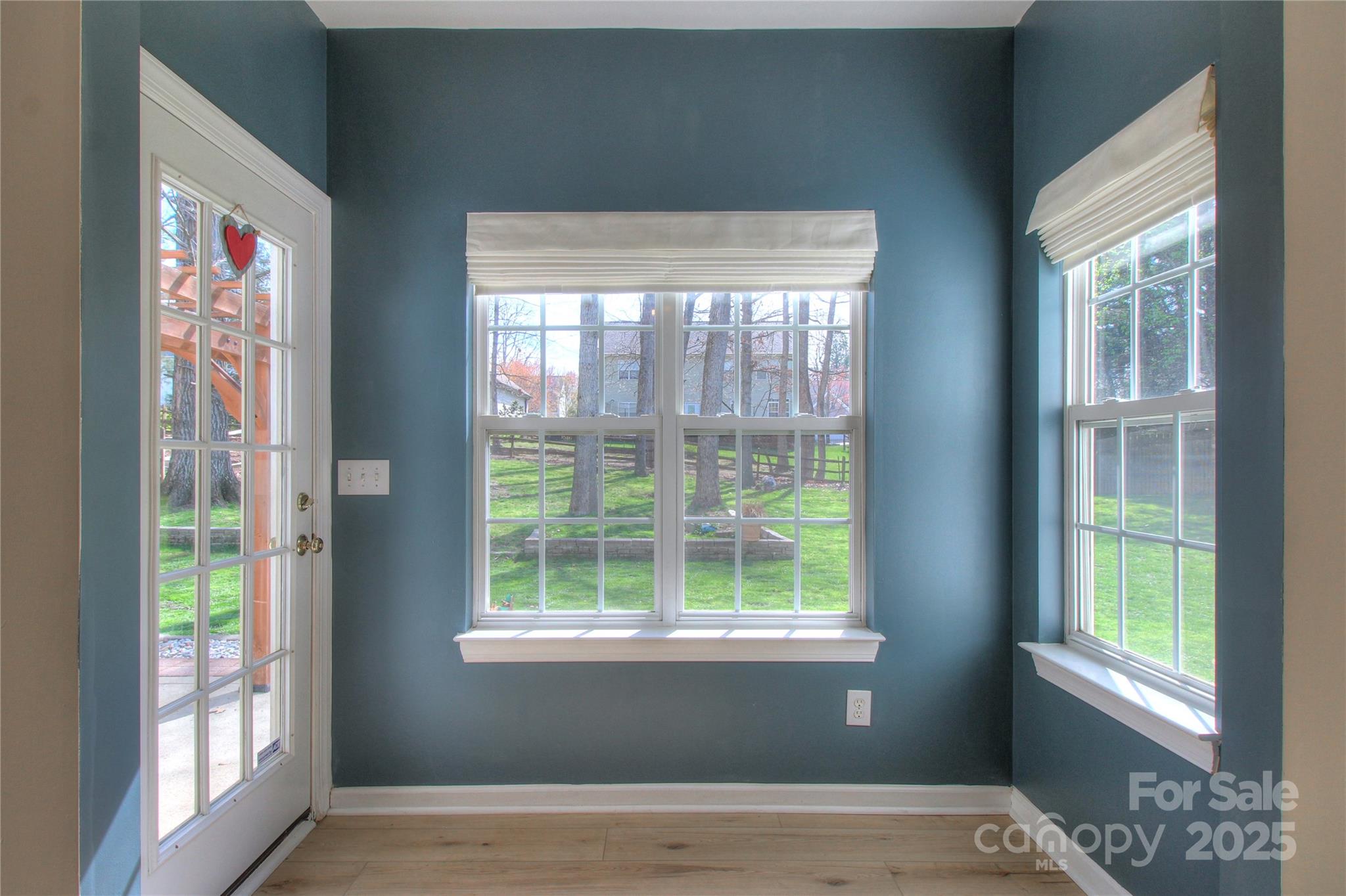 8414 Bampton Drive Concord, NC 28027 - Photo 8 of 32 a view of an entryway with wooden floor