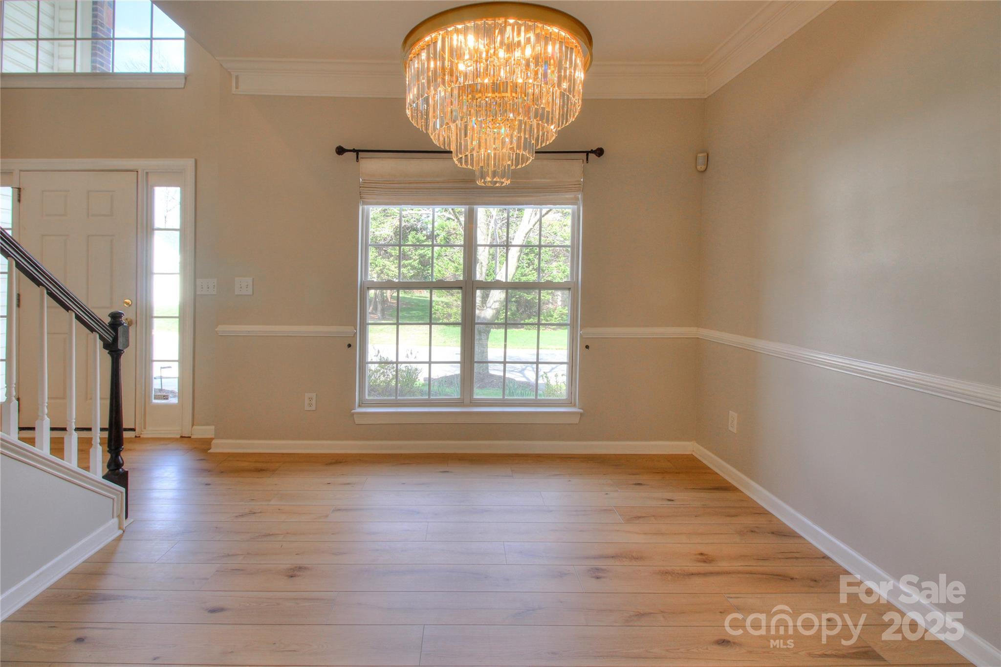 8414 Bampton Drive Concord, NC 28027 - Photo 9 of 32 a view of empty room with wooden floor and fan