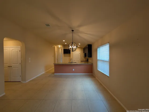 a view of a room with a chandeliers