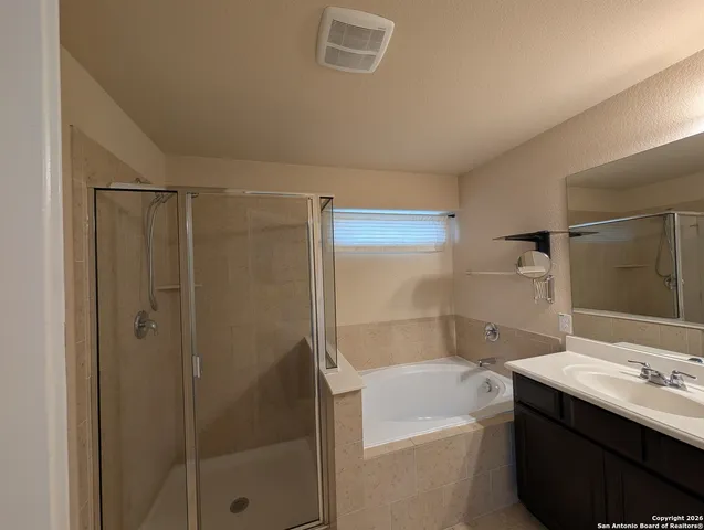 a bathroom with a bathtub and a sink