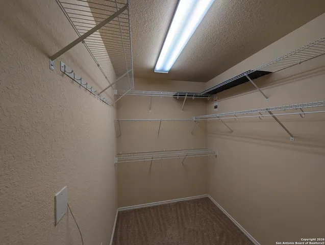 a view of a room with racks on the wall