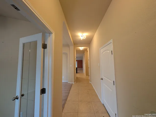 a view of a hallway with a white walls