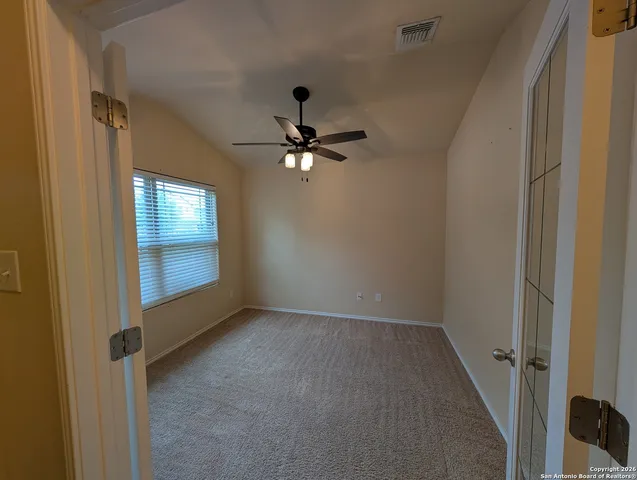 a view of an empty room with a window