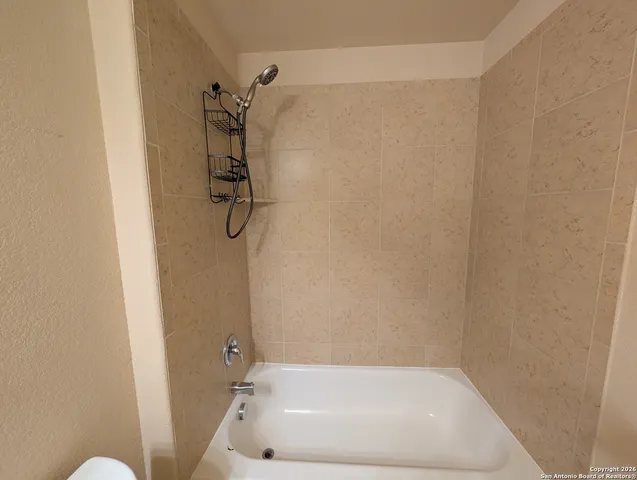 a bathroom with a bath tub