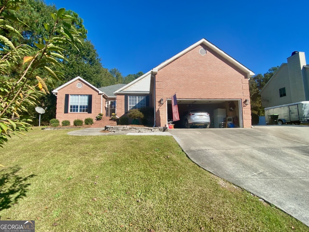 103 Fawn Court Byron, GA 31008 - Photo 1 of 23 a front view of a house with a yard and garage
