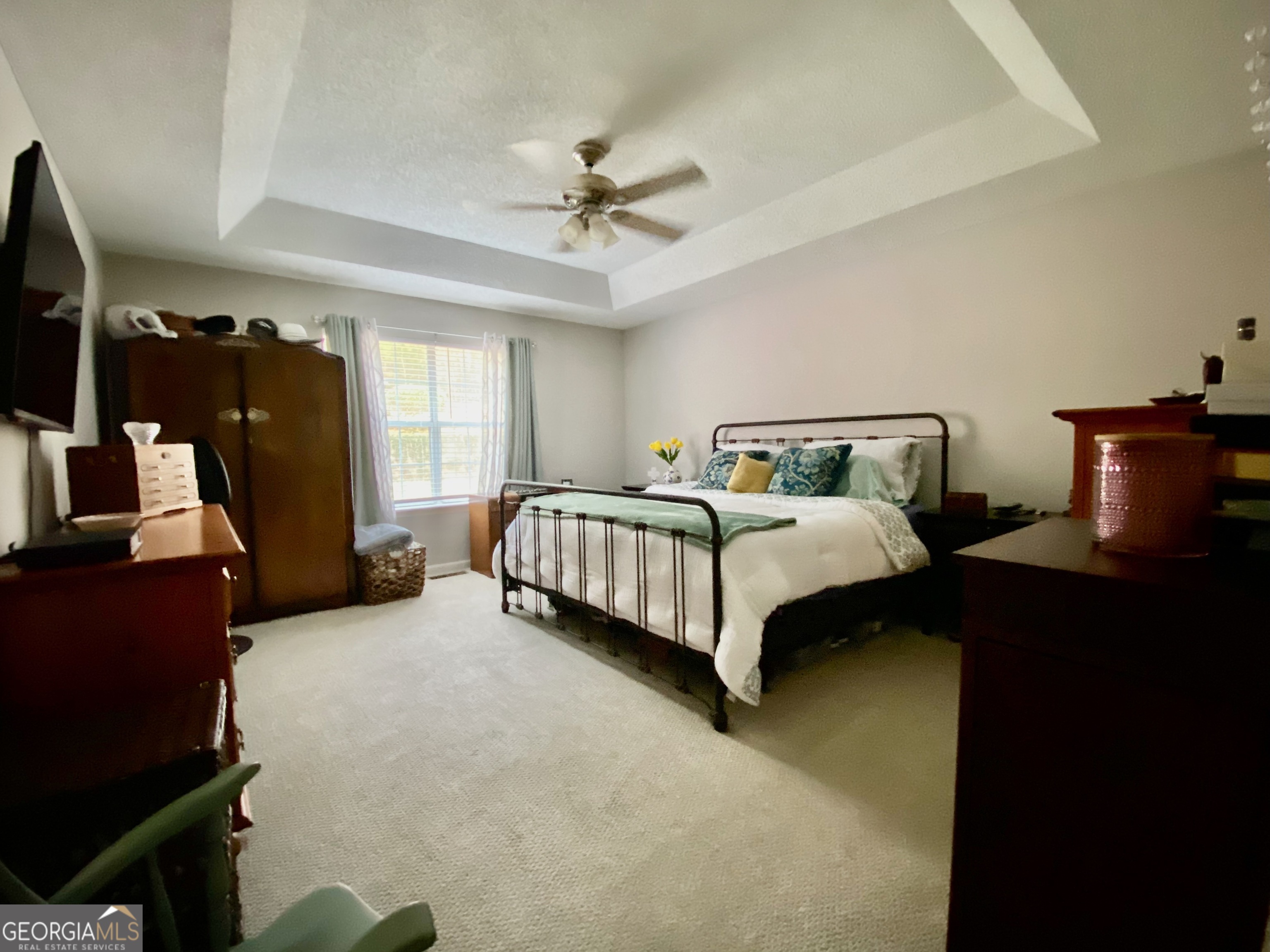 103 Fawn Court Byron, GA 31008 - Photo 11 of 23 a spacious bedroom with a bed and a chandelier