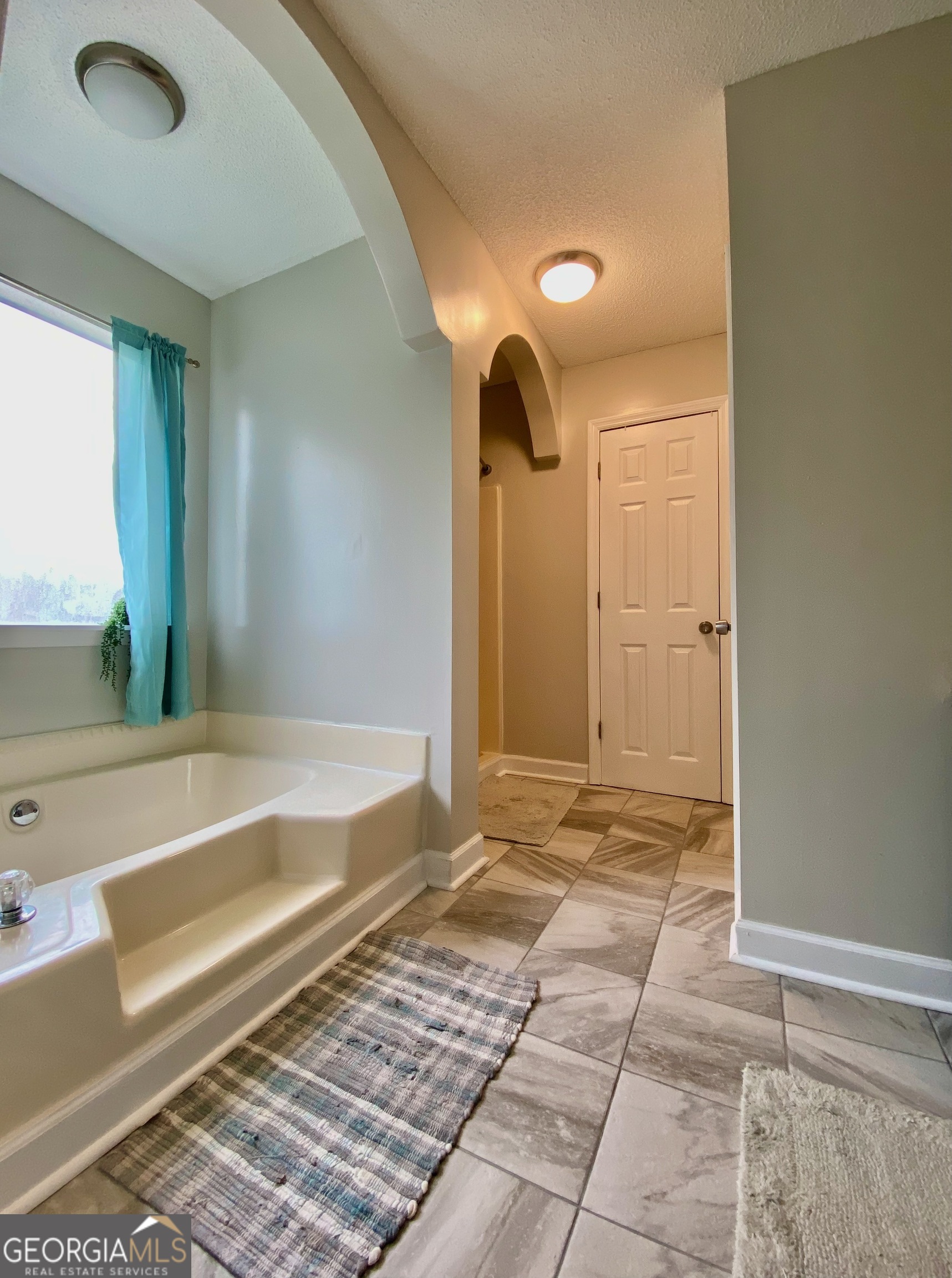 103 Fawn Court Byron, GA 31008 - Photo 12 of 23 a bathroom with a vanity and a bathtub