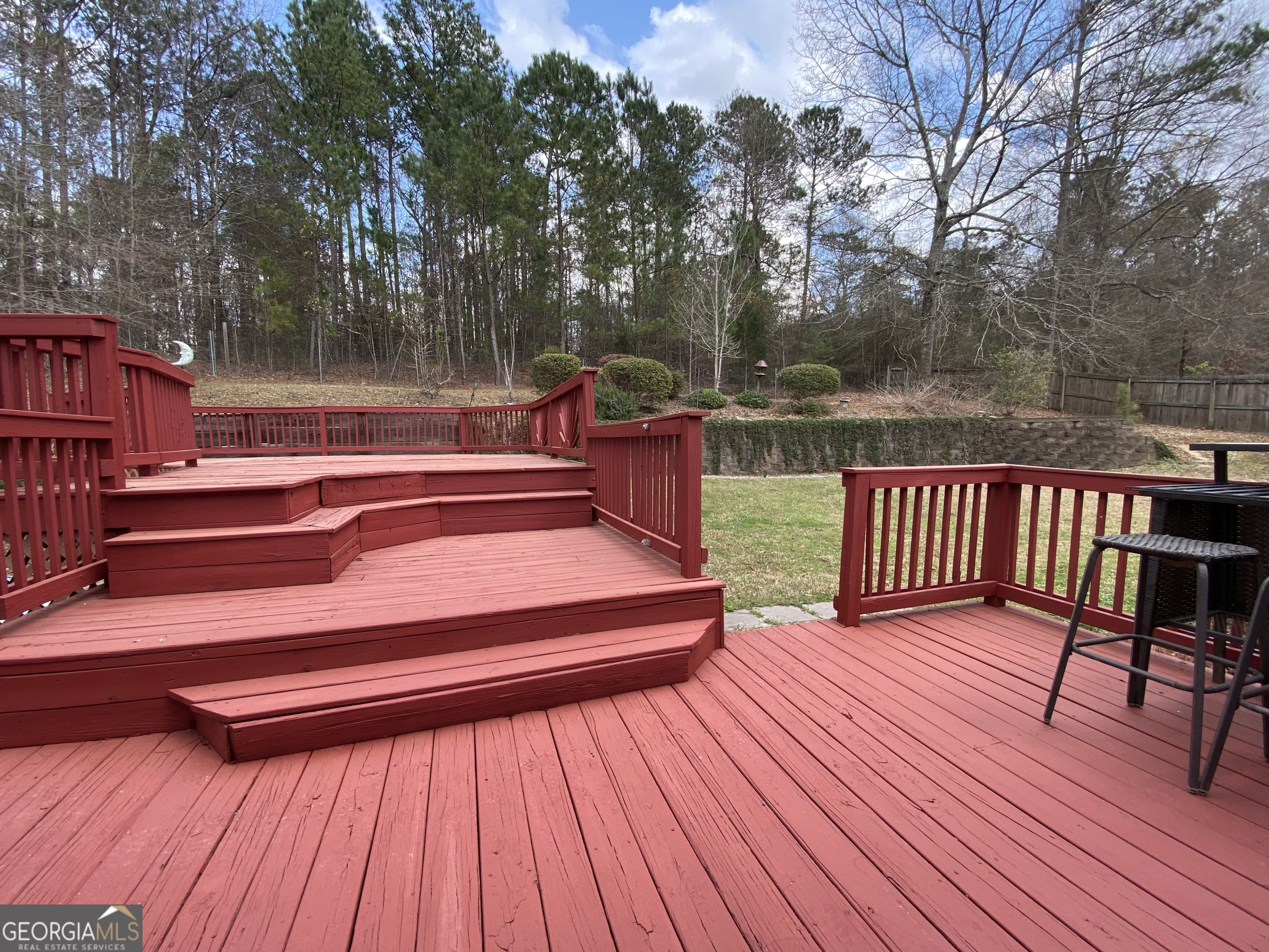 103 Fawn Court Byron, GA 31008 - Photo 19 of 23 a balcony with wooden floor table and chairs