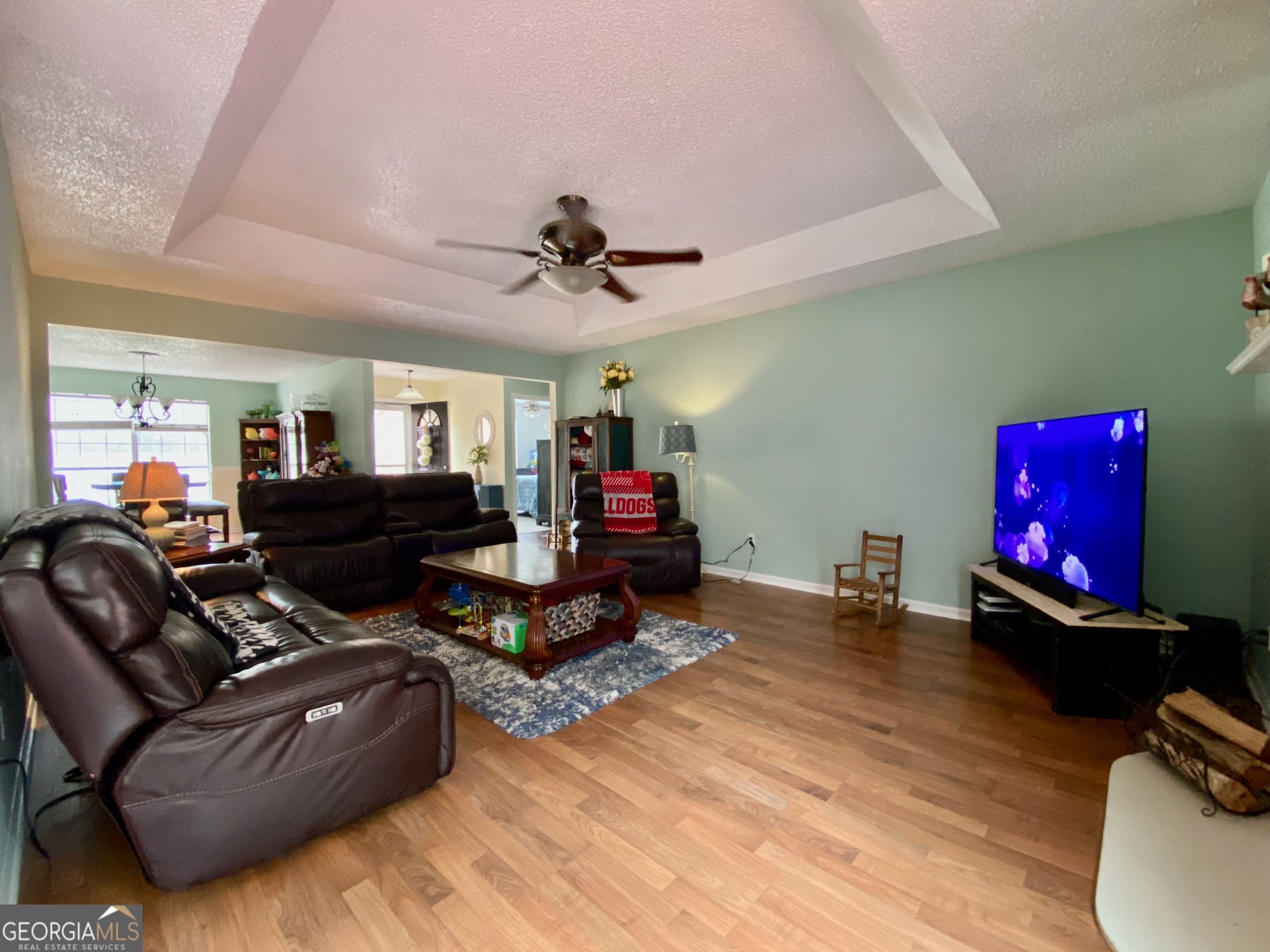 103 Fawn Court Byron, GA 31008 - Photo 4 of 23 a living room with furniture gym equipment and a wooden floor