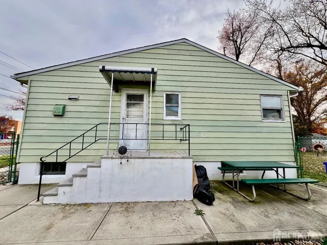 a front view of a house with a patio