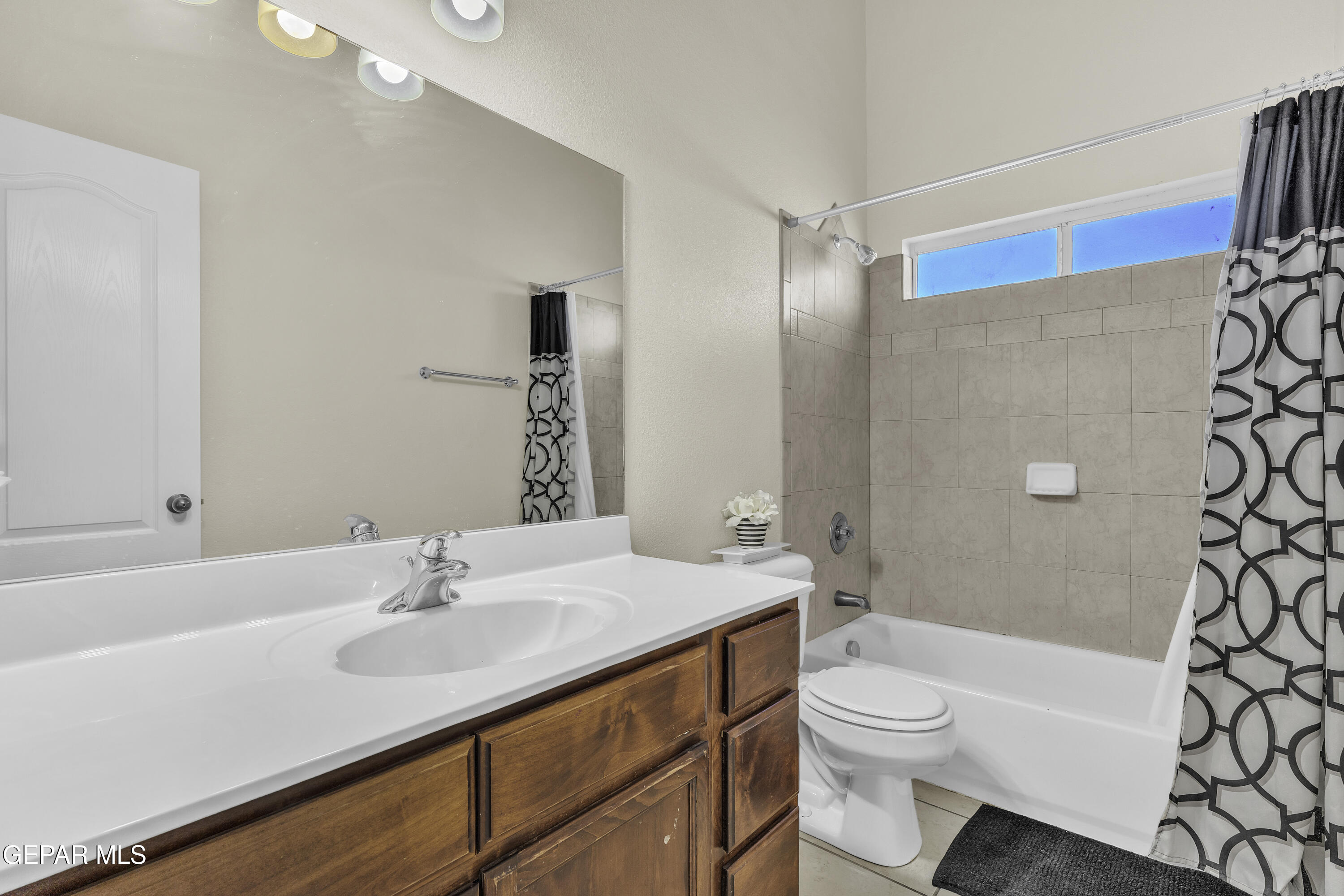 14401 Delta Point Court El Paso, TX 79938 - Photo 13 of 49 a bathroom with a sink a toilet a mirror and shower