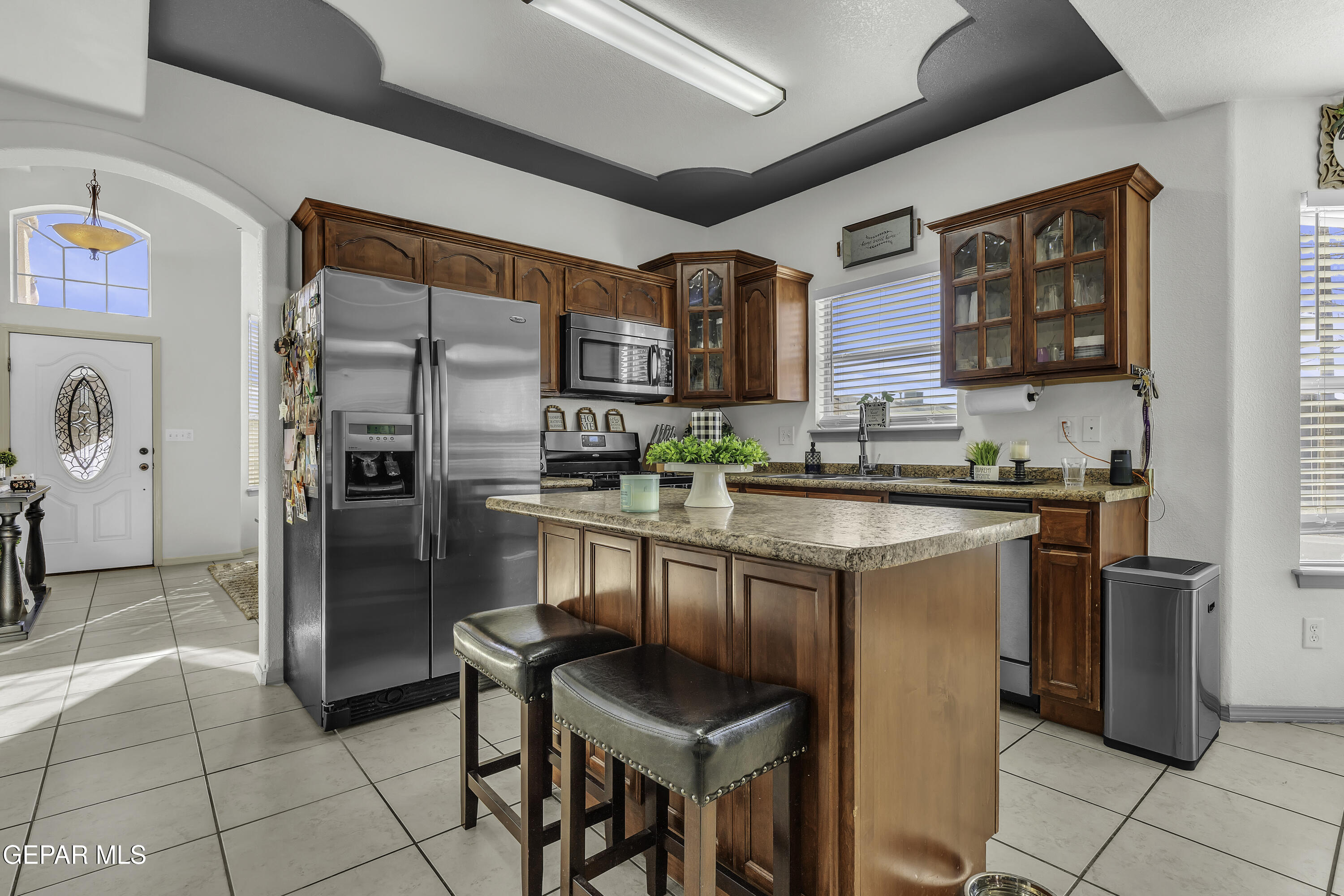 14401 Delta Point Court El Paso, TX 79938 - Photo 14 of 49 a kitchen with stainless steel appliances granite countertop a refrigerator and a stove top oven