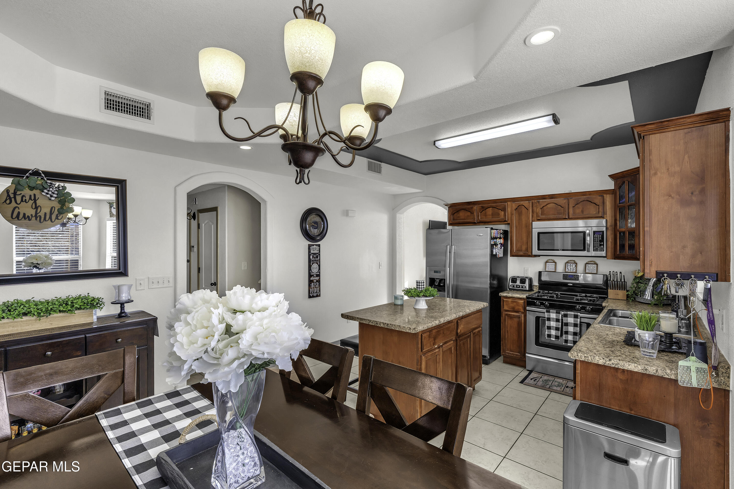 14401 Delta Point Court El Paso, TX 79938 - Photo 21 of 49 a view of a dining room and hall with furniture