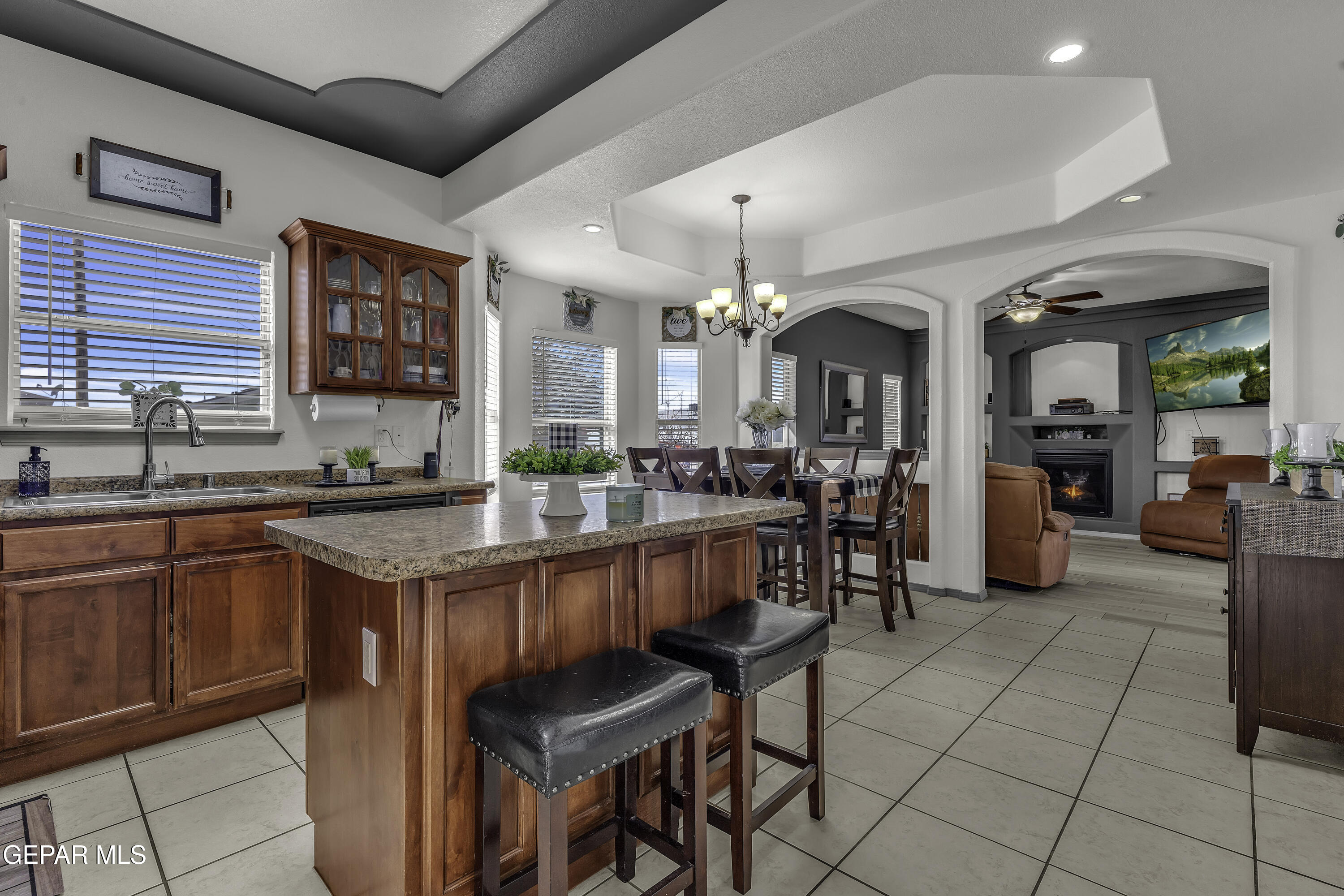 14401 Delta Point Court El Paso, TX 79938 - Photo 39 of 49 a kitchen with stainless steel appliances granite countertop sink stove and cabinets