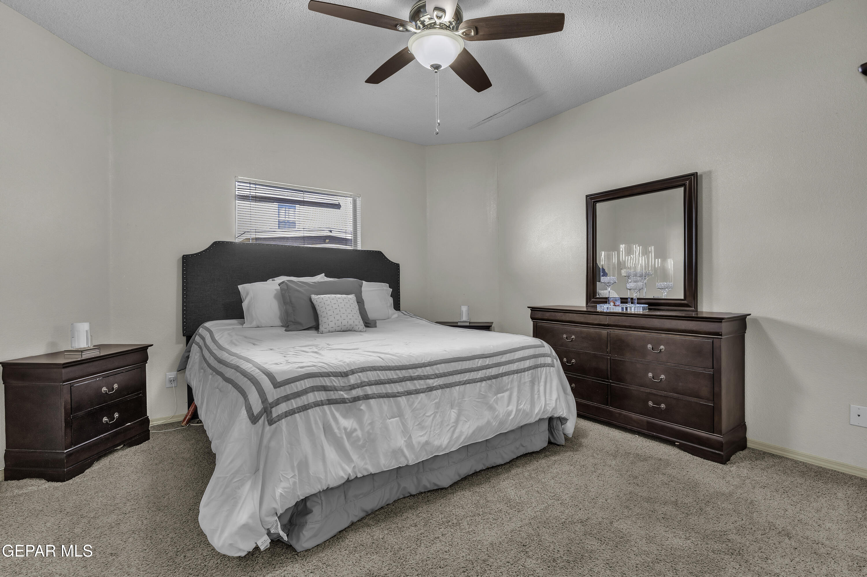 14401 Delta Point Court El Paso, TX 79938 - Photo 43 of 49 a bedroom with a bed and a ceiling fan