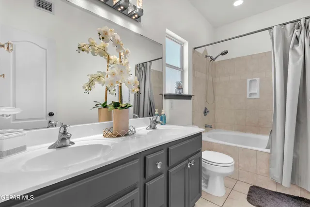 a living room with furniture and flat screen tv