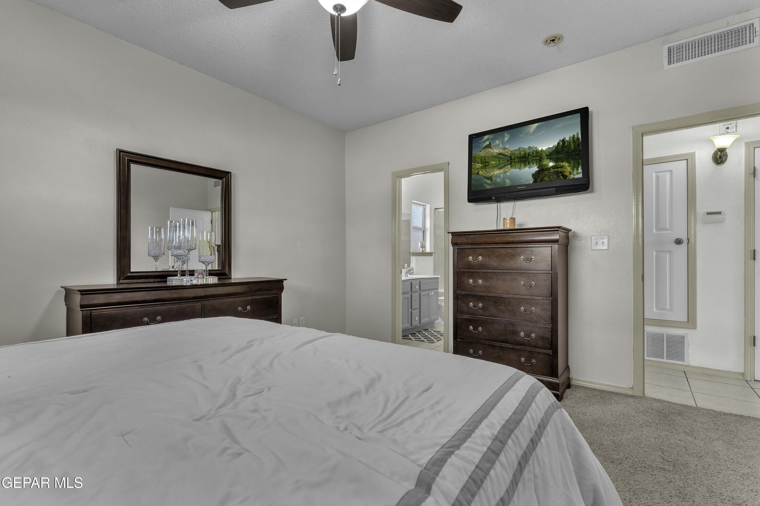 14401 Delta Point Court El Paso, TX 79938 - Photo 46 of 49 a bedroom with a bed and a flat screen tv